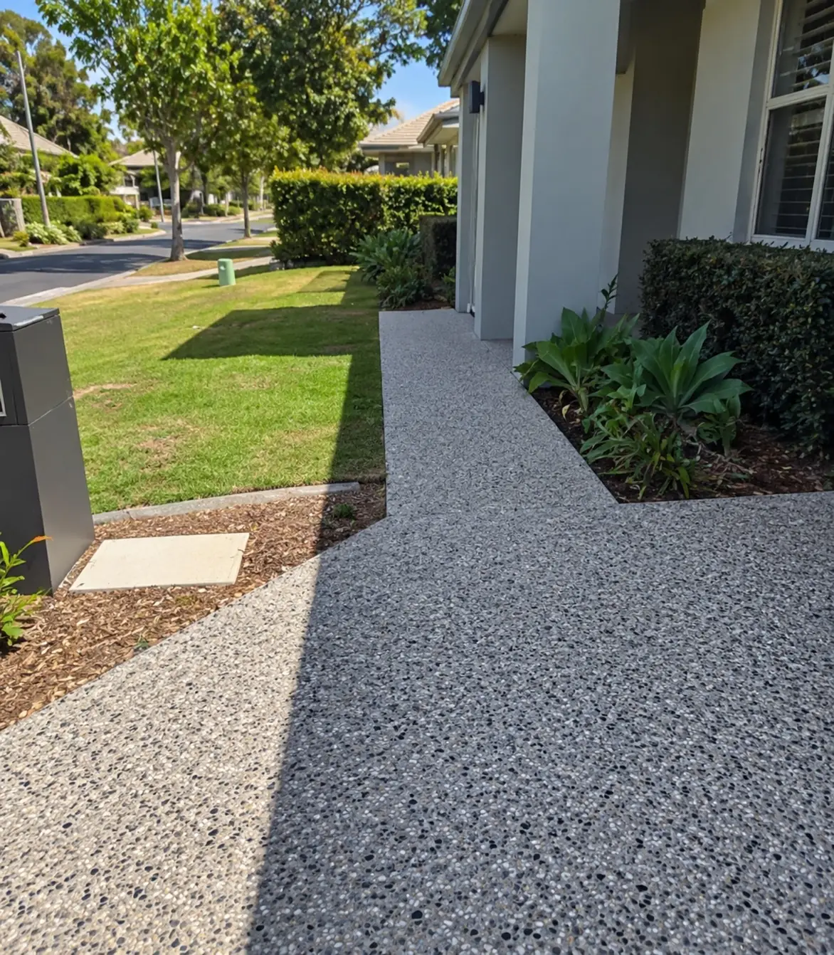 Light exposed aggregate pathway along the side of a home, Cairns